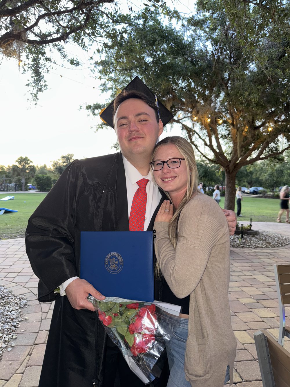 Peyton J. Redfield at graduation in cap and gown